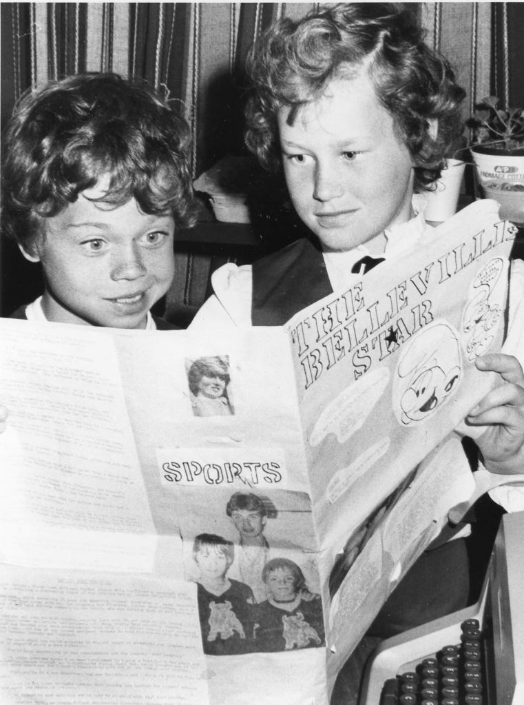 Two children looking at a handmade newspaper called The Belleville Star. Belleville, Ontario, ca 1980. Credit: Community Archives of Belleville & Hastings.